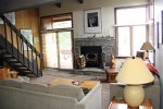 Mammoth Condo Rental Sunrise 3 - Living Room with Woodburning Stove and New Rock Hearth
